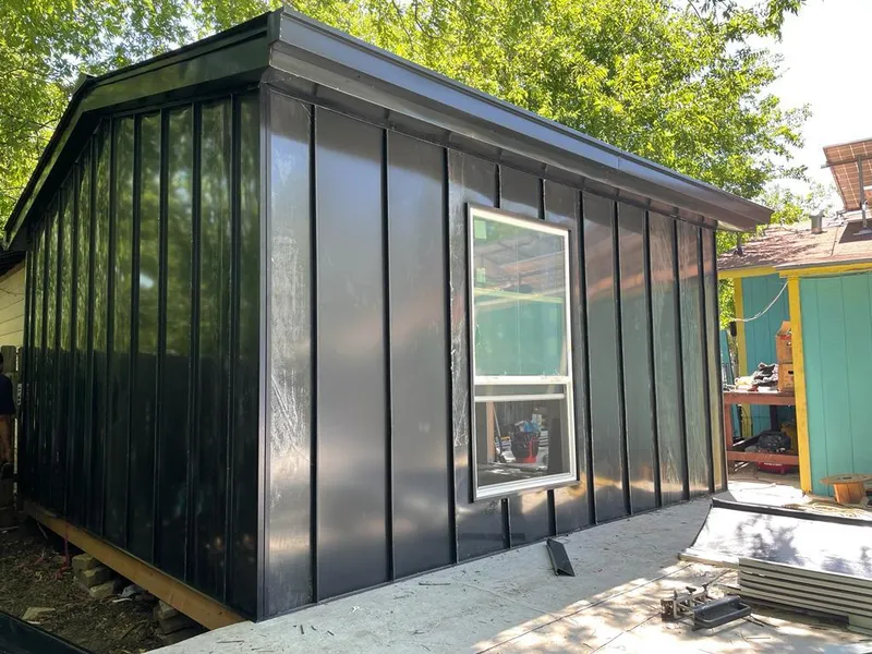 Black standing seam metal wall panels for Roof Inspection in Three Oaks